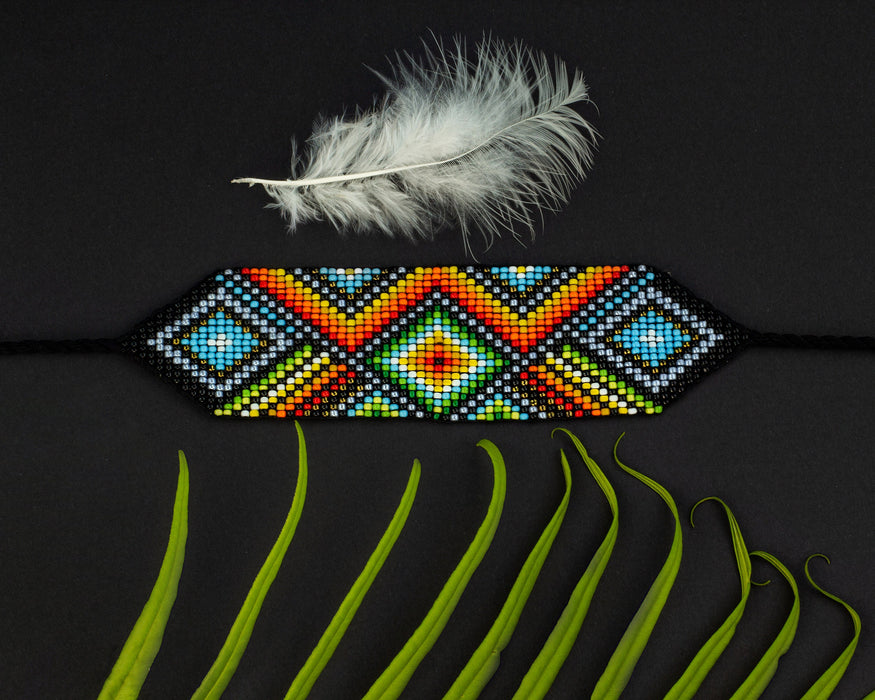 Handwoven bead loom bracelets with Ayahuasca-inspired tribal patterns, combining shamanic tools and talisman amulets for spiritual adornment