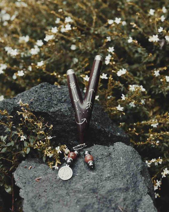 Wooden Intention kuripe pipe necklace with silver accents for hape snuff, a unique, handcrafted shamanic tool for herbal medicine rituals.