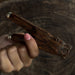 Unique kuripe pipe featuring a bear totem, handcrafted from mango wood