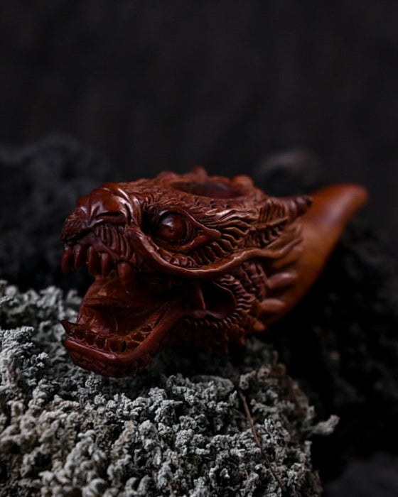 Distinctive wood smoking pipe featuring a dragon design, perfect for those who want to make a statement.