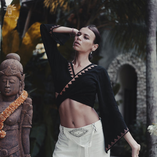 Crafted by the skilled artisans at Ayaho House shaman workshop in Bali, this top is more than just clothing—its a piece of wearable art that resonates with the spirits of nature and authenticity