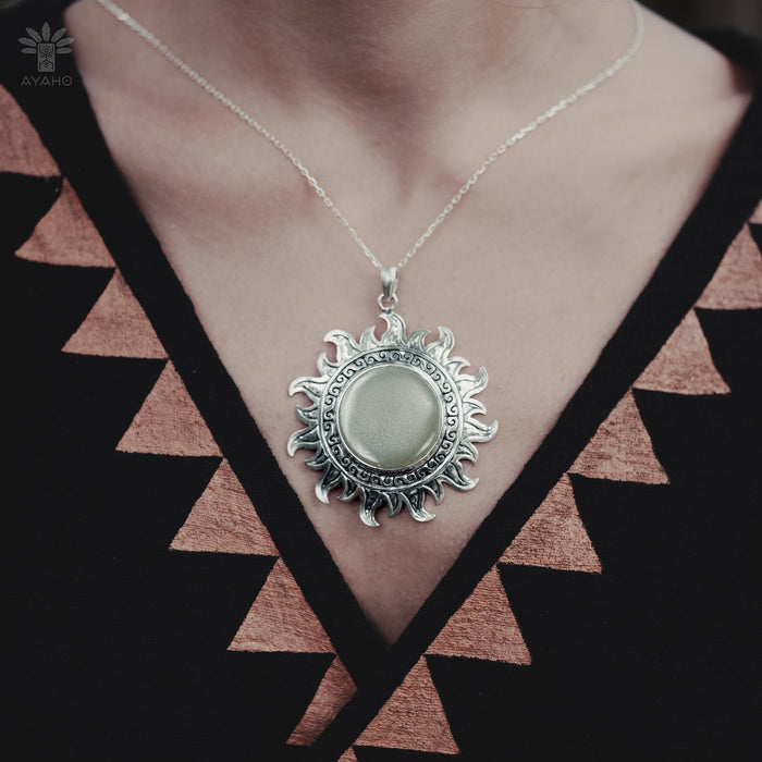 Striking ye ming zhu pendant encapsulated in intricate silver, a magic item believed to grant protection and fortune, perfect for anniversaries or spiritual milestones