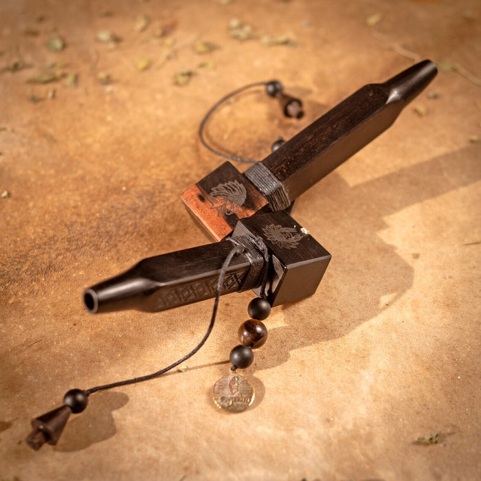 Wooden tool with metal components on a textured brown surface