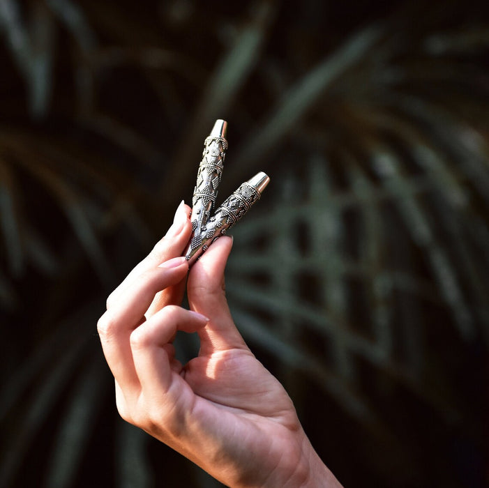 Ethnically patterned kuripe of silver