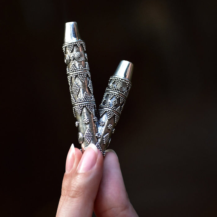 Ethnically patterned kuripe of silver