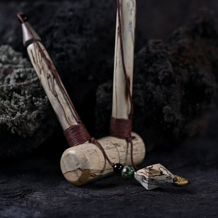 Wooden tools with a natural finish on a dark textured background