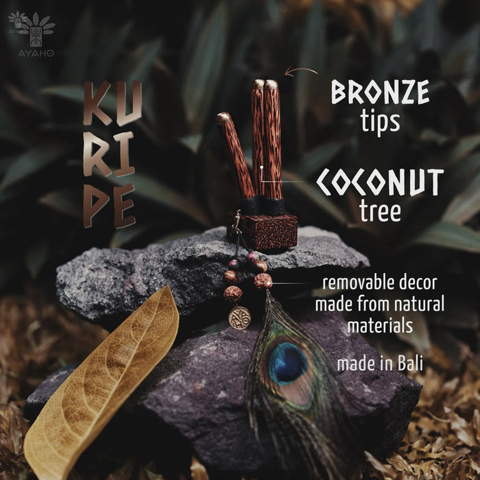 Decorative item with bronze tips and coconut tree elements on a natural background