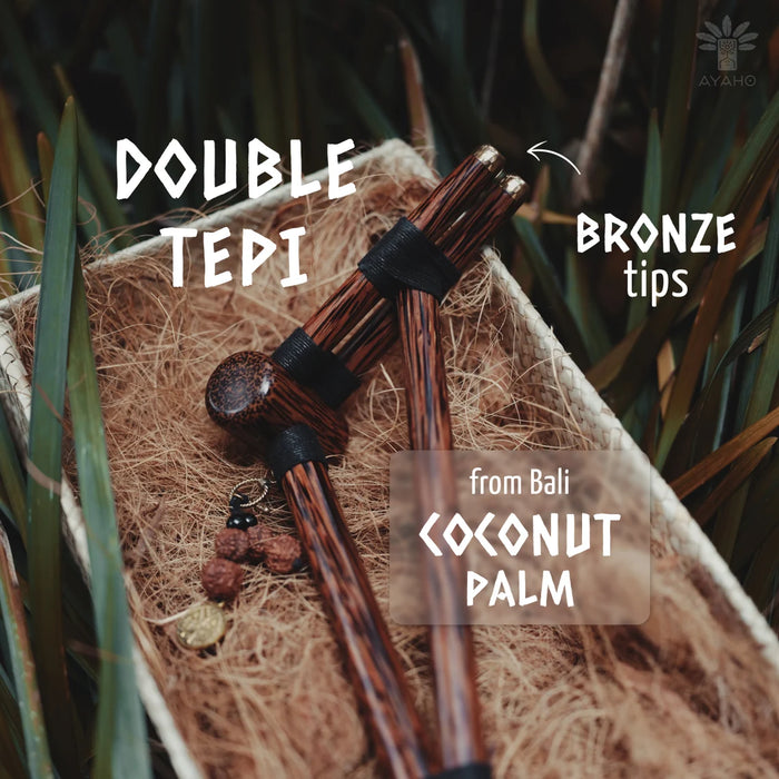 Double Tepi with bronze tips on a natural background with text indicating origin and material.