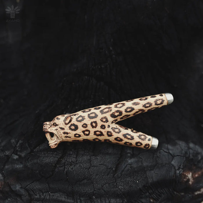 Leopard print object on a textured black surface