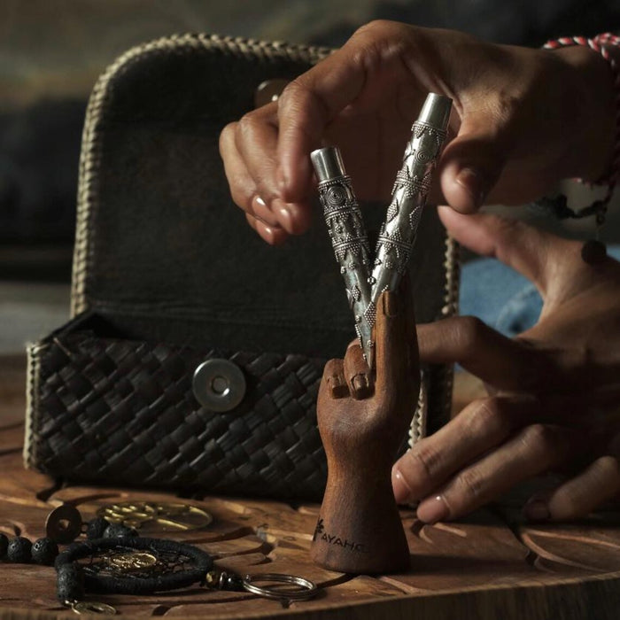 Ethnically patterned kuripe of silver