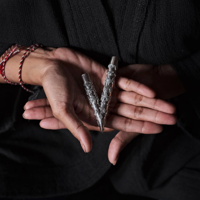 Ethnically patterned kuripe of silver