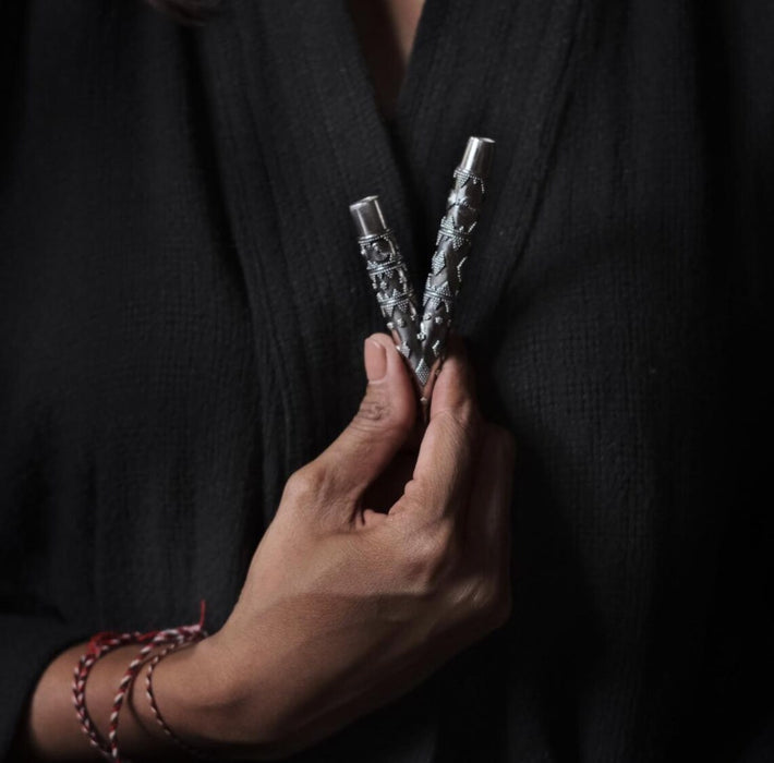 Ethnically patterned kuripe of silver