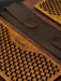 Wooden tool with textured surface and brown leather strap, featuring 'PIN YOGA' branding.