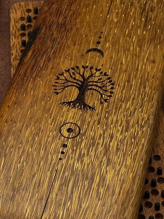 Wooden surface with a tree engraving
