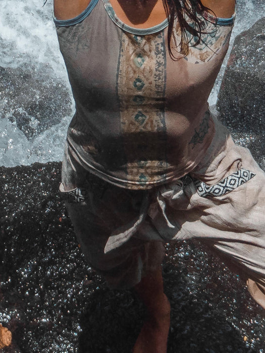 Bohemian-style women’s top with a relaxed fit and earth-tone batik design, crafted with care