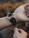 Dark buffalo leather bracelet with triple-infinity design — embodies life cycles, eternal flow, and inner harmony