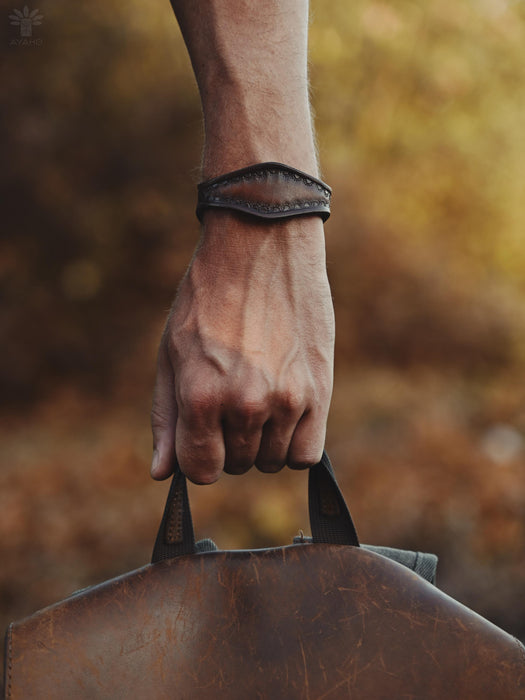 Buffalo leather bracelet with a sculptural triple-infinity design, ideal for rituals, grounding, or daily wear.