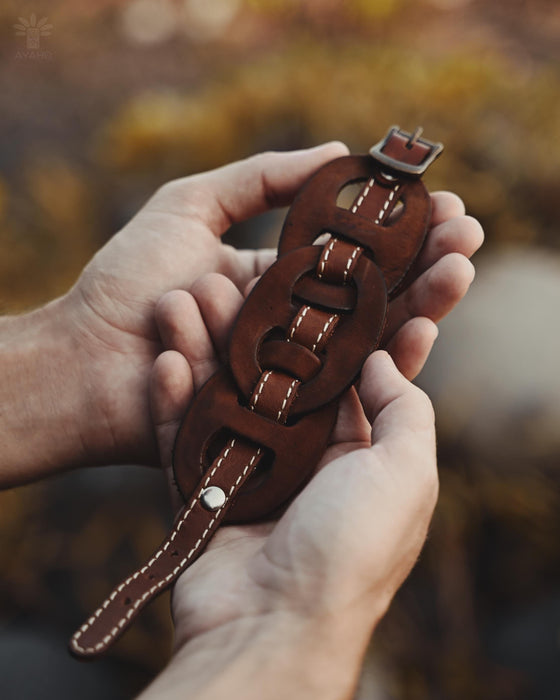 Raw buffalo hide bracelet with a handcrafted triple-infinity design, perfect for grounding energy and spiritual connection.