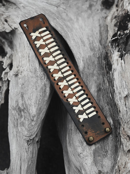 Wide cuff buffalo leather bracelet, hand-crafted with a bold ethnic design, perfect for grounding and spiritual practices.