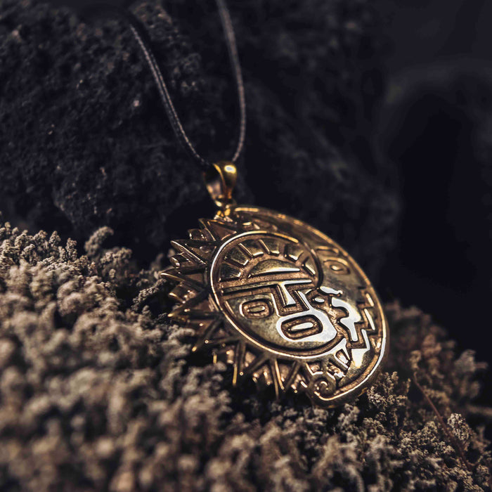 Antique bronze sun and moon amulet necklace, a mystical talisman symbolizing balance and offering protection, perfect as a magic item for anniversaries or as a spiritual safeguard