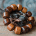 Embrace the protective essence of our 'Agarwood Essence' bracelet, meticulously crafted from valuable agarwood by skilled artisans in Bali. Beyond its beauty, it offers spiritual benefits and mental clarity, making it a meaningful accessory for everyday wear or special occasions. Gift this unique piece for a touch of spiritual wellbeing and sustainable elegance.