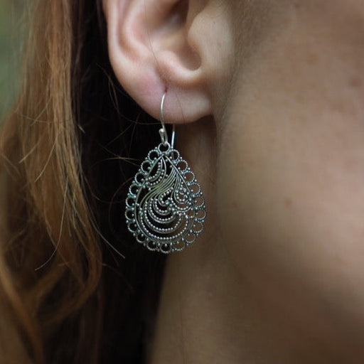 Experience the enchantment of our 'Firebird's Grace' earrings, meticulously crafted by Bali's Ayaho shamanic workshop. Adorned with a mystical firebird motif, they offer both elegance and protective power, embodying ancient wisdom and cultural richness. 