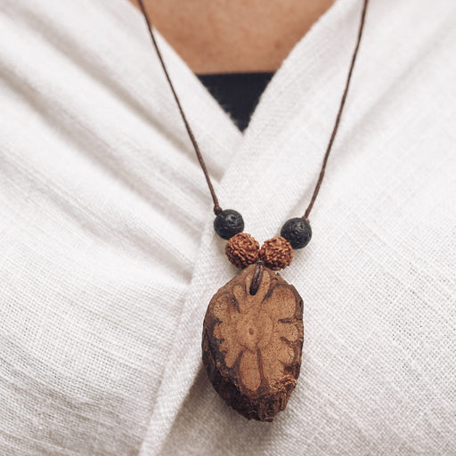 Embrace the spiritual essence of our Handmade Amulet, crafted from the Sacred Caapi vine, Rudraksha seeds, and lava stones from Mount Agung. This talisman promotes profound connection, resilience, and spiritual growth while protecting against negativity. Perfect for those on a spiritual journey, seeking balance and inner harmony.