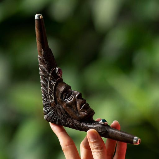 Carved Tepi pipe with an Indian face design, used as a traditional hape snuff applicator, a handcrafted smoking tool for mapacho and herbs, serves as a unique protective kit