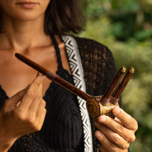 This Tepi pipe, handcrafted with sacred geometry and Peruvian ayahuasca inspiration, offers a profound spiritual connection for ceremonial Rapéh. Ideal for meditation, its a powerful symbol of healing and protection, and a unique gift for those