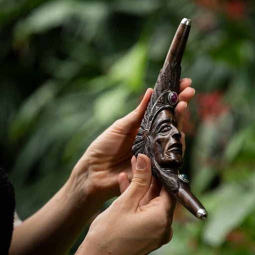 Carved Tepi pipe with an Indian face design, used as a traditional hape snuff applicator, a handcrafted smoking tool for mapacho and herbs, serves as a unique protective kit