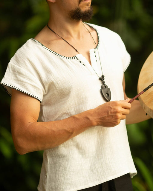 Crafted with meticulous attention to detail and a deep respect for ancient traditions, this boho-style short sleeve shirt is more than just clothing; it&#39;s a statement of identity and power